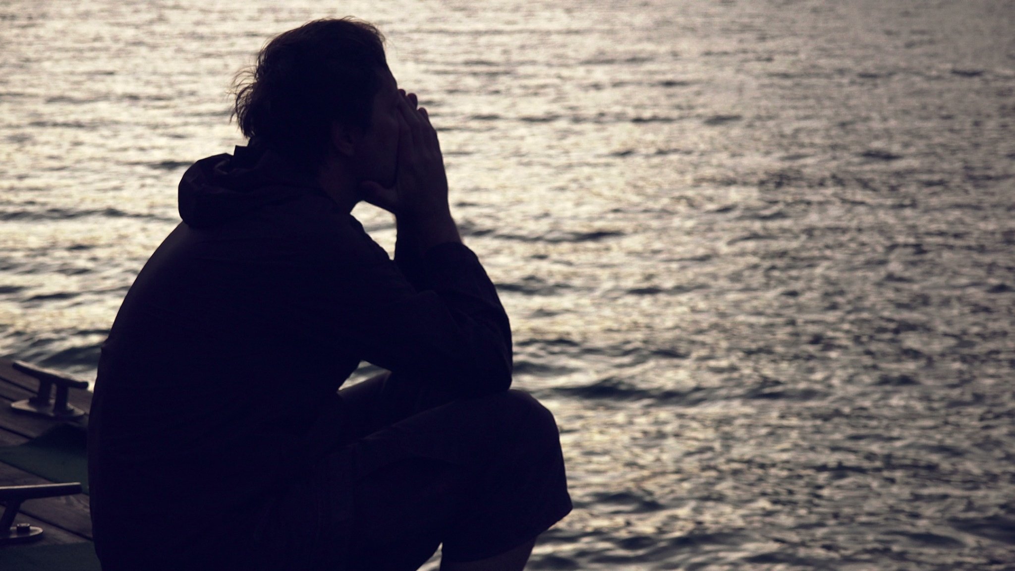 silhouette-depressed-sad-man-sitting-footage-085605604_prevstill